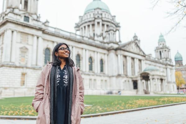 Student Florence stands in front of Belfast city hall
