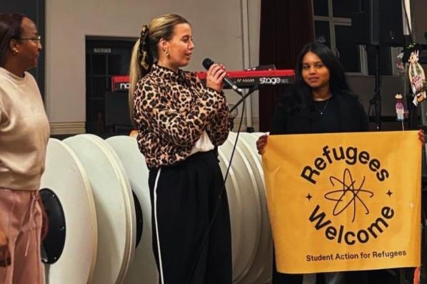 Ornait from QUB STAR speaking at refugees event