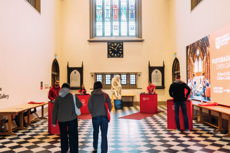 Staff in Black and White Hall for PG open day