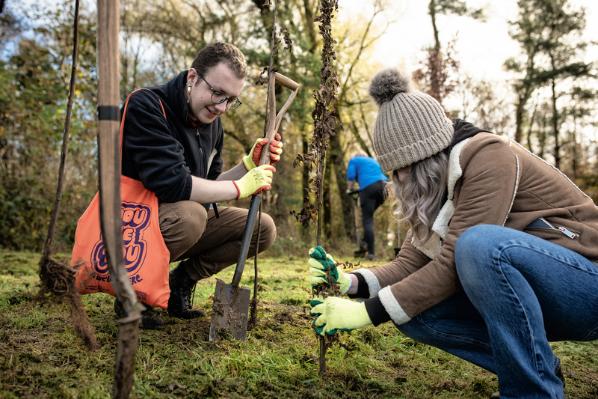 Students volunteering outdoors